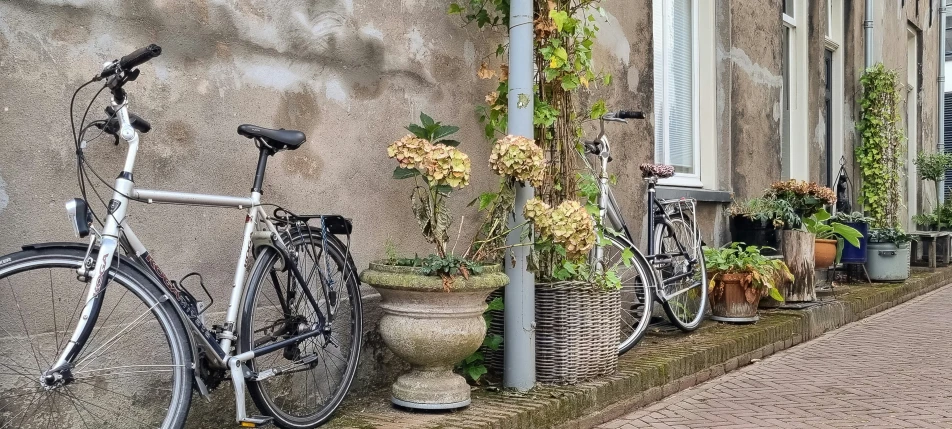 bicycle leaning against a wall in front of buildings