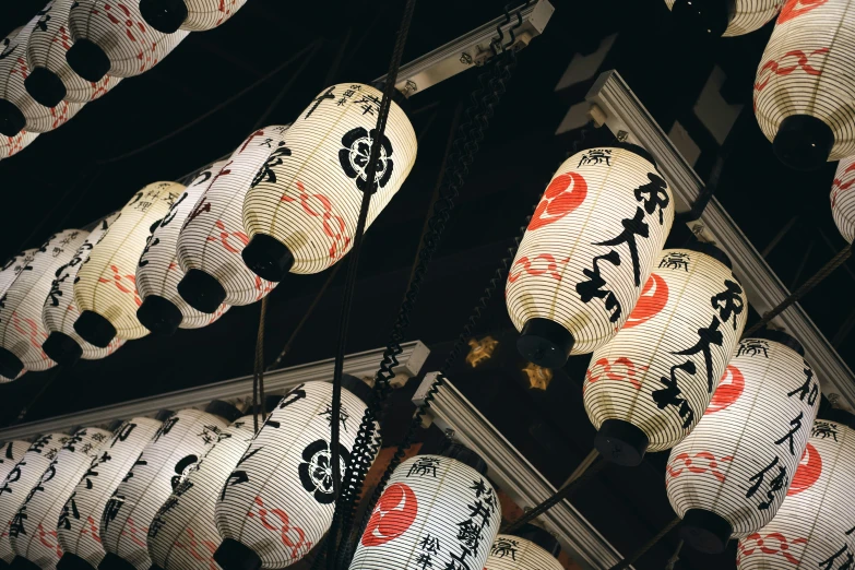 decorative lanterns hang from the ceiling at night