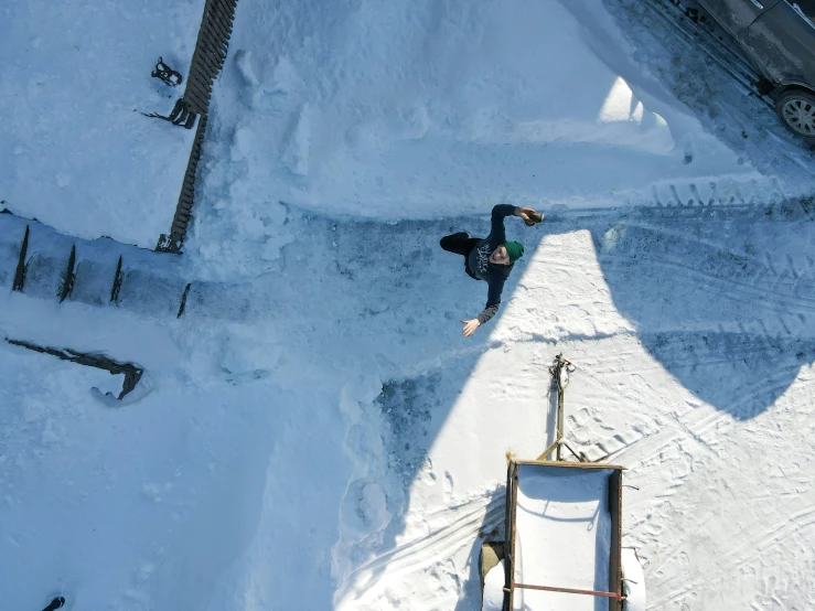 the snowboarder is about to come down the hill