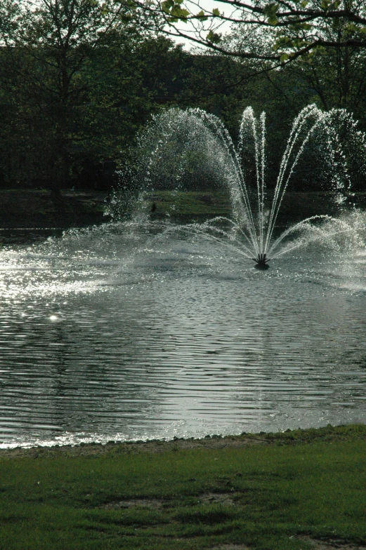 this picture shows a water fountain with four jets