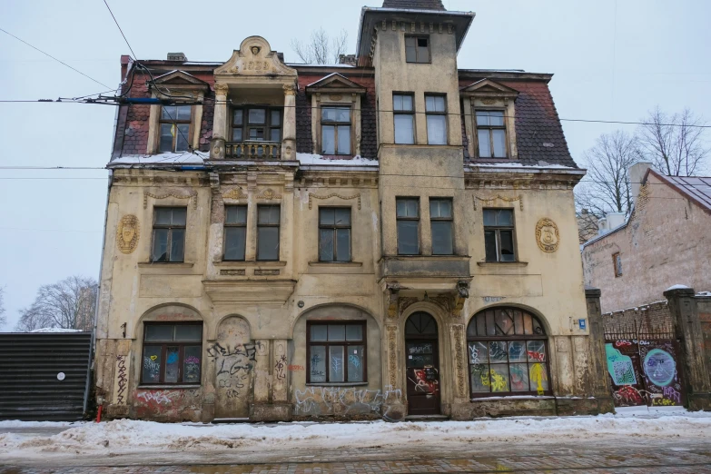 an old stone building with graffiti on the window