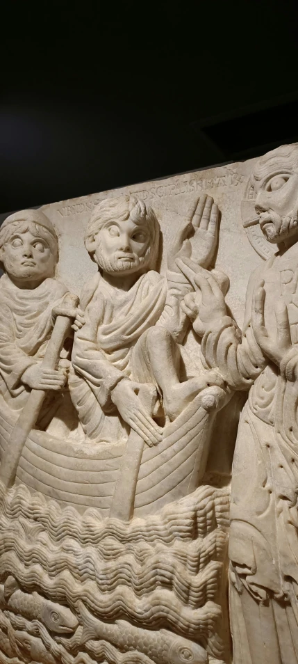 a relief depicting an individual being served by other people