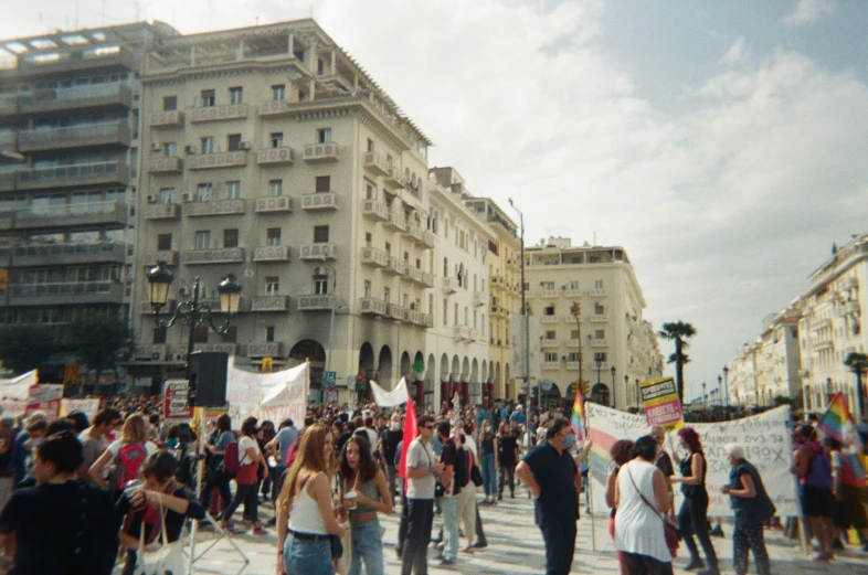 a huge group of people are protesting in the streets