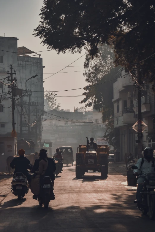 a couple of people on motorcycles in the street