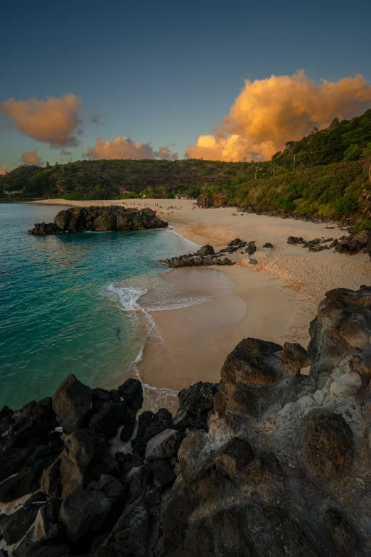 an idyllic beach with an island in the distance