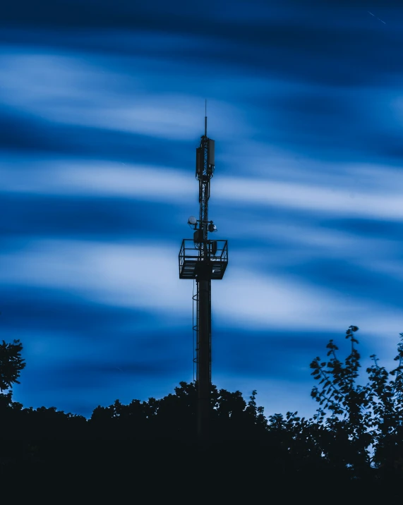 the sky over a very tall radio mast