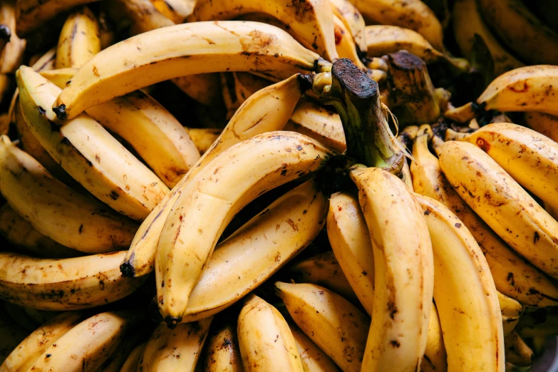an assortment of ripe bananas piled in pile