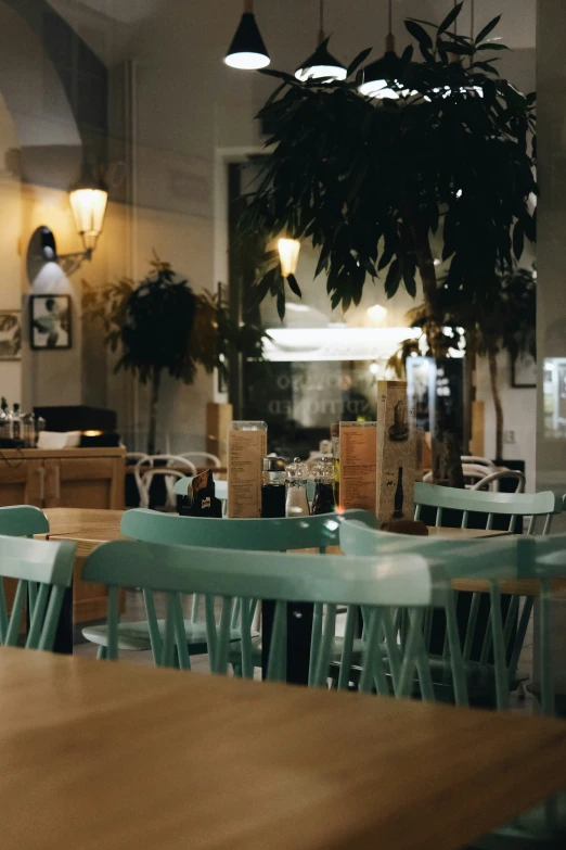 a restaurant has several tables with chairs in it