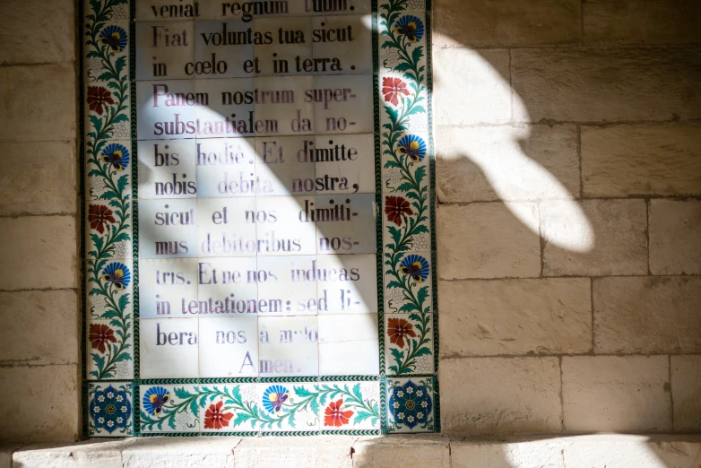 a decorative glass with some writing on it