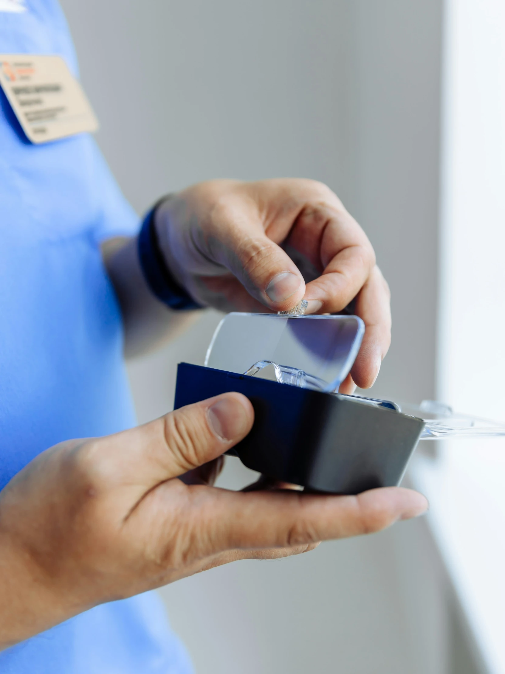 a woman holding a cell phone in her hands