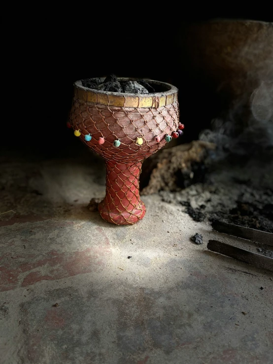 a fire bucket and some spoons near a window