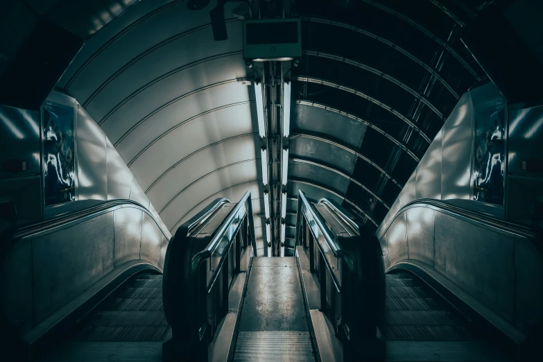 an image of an escalator in a subway station