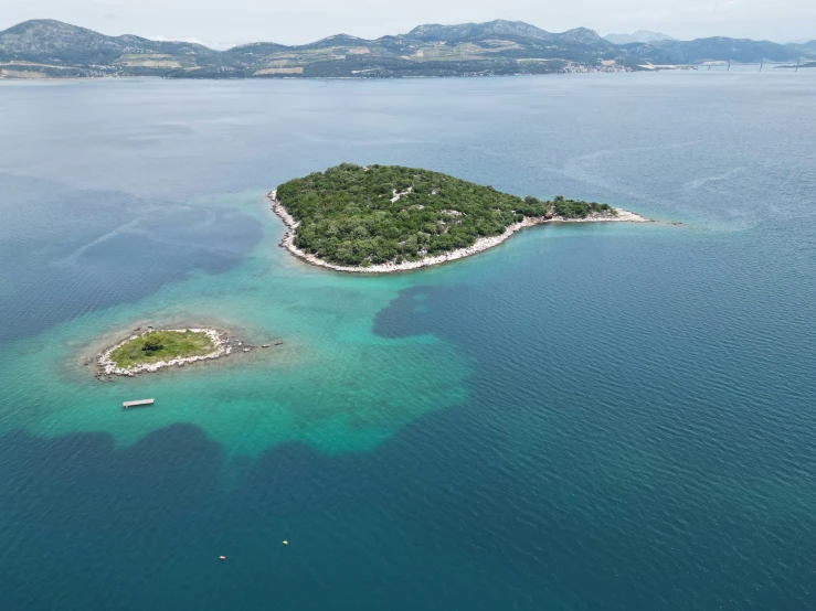 an island is shown in the middle of the ocean