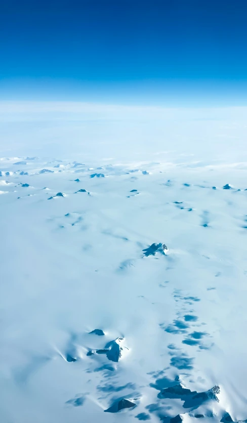 a view from an airplane of ice floes