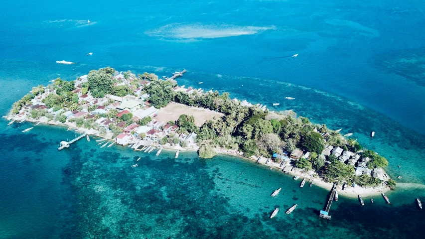 an aerial view of a tiny island in the water