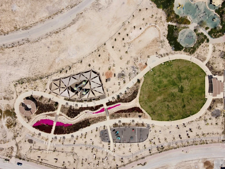 an aerial view of a large parking lot in a desert