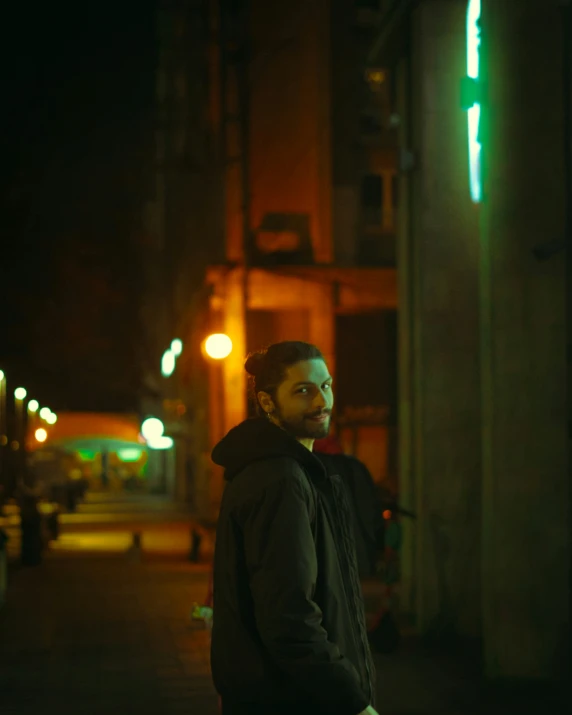 a man standing on the side of the road looking to his left