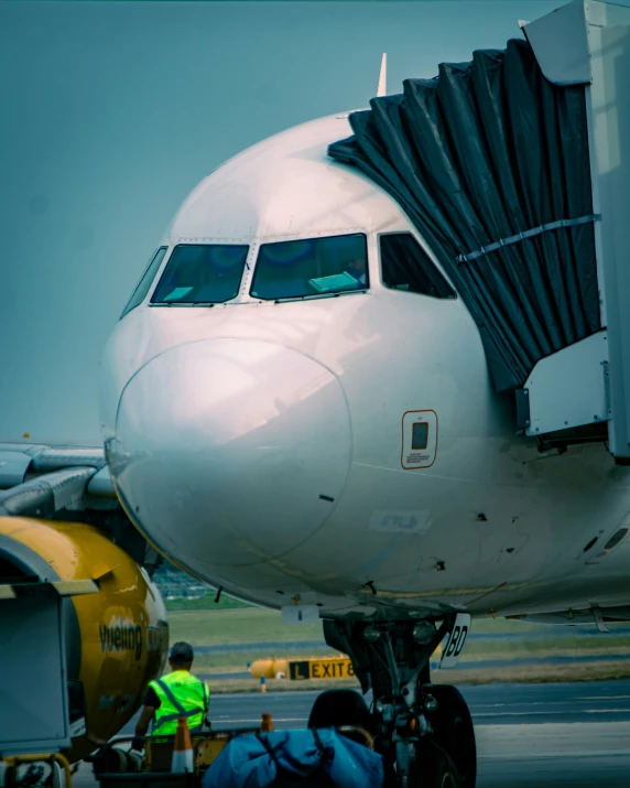 a large airplane is pulled into the tarmac