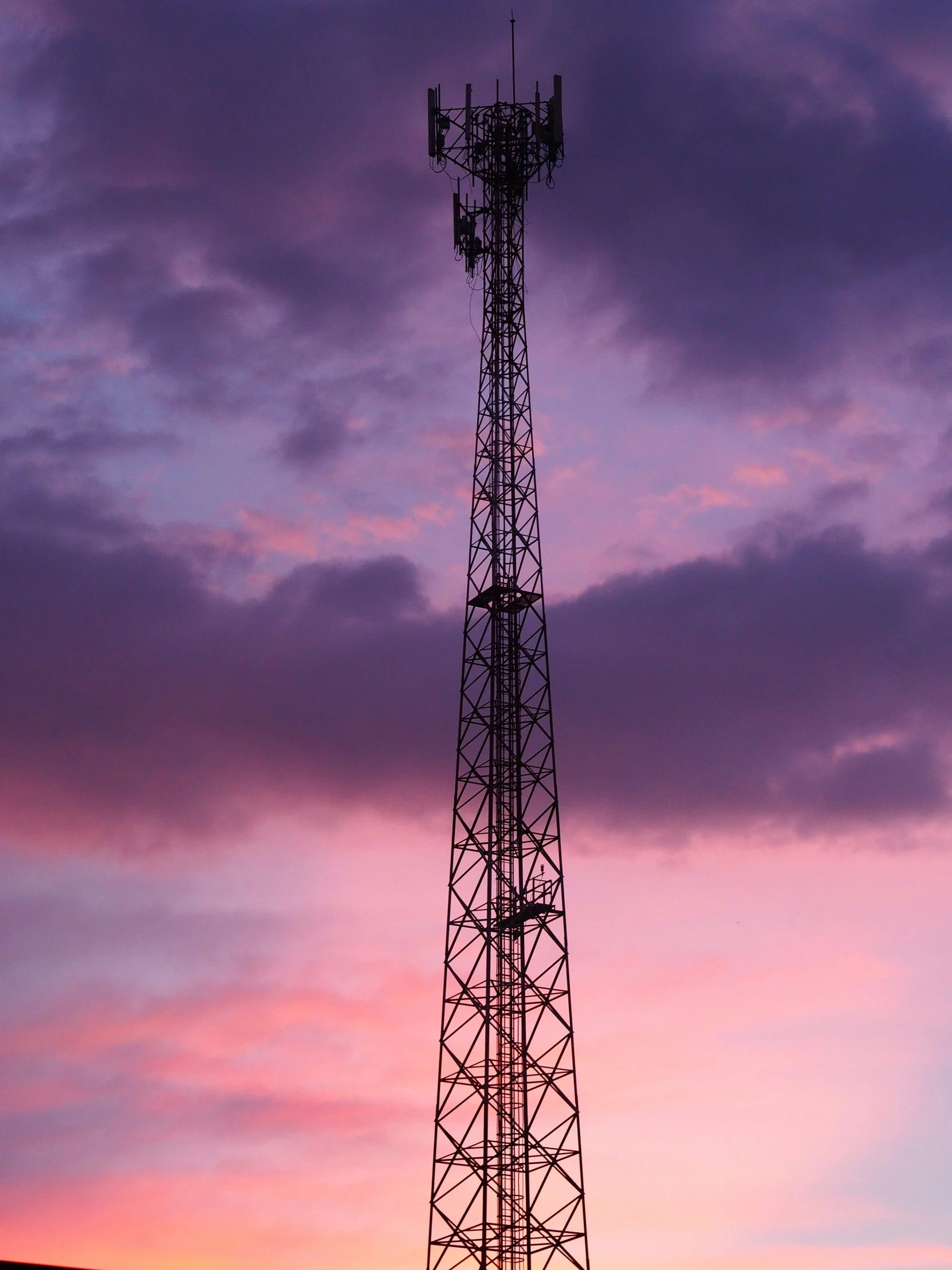 a tall tower with a lot of antenna towers