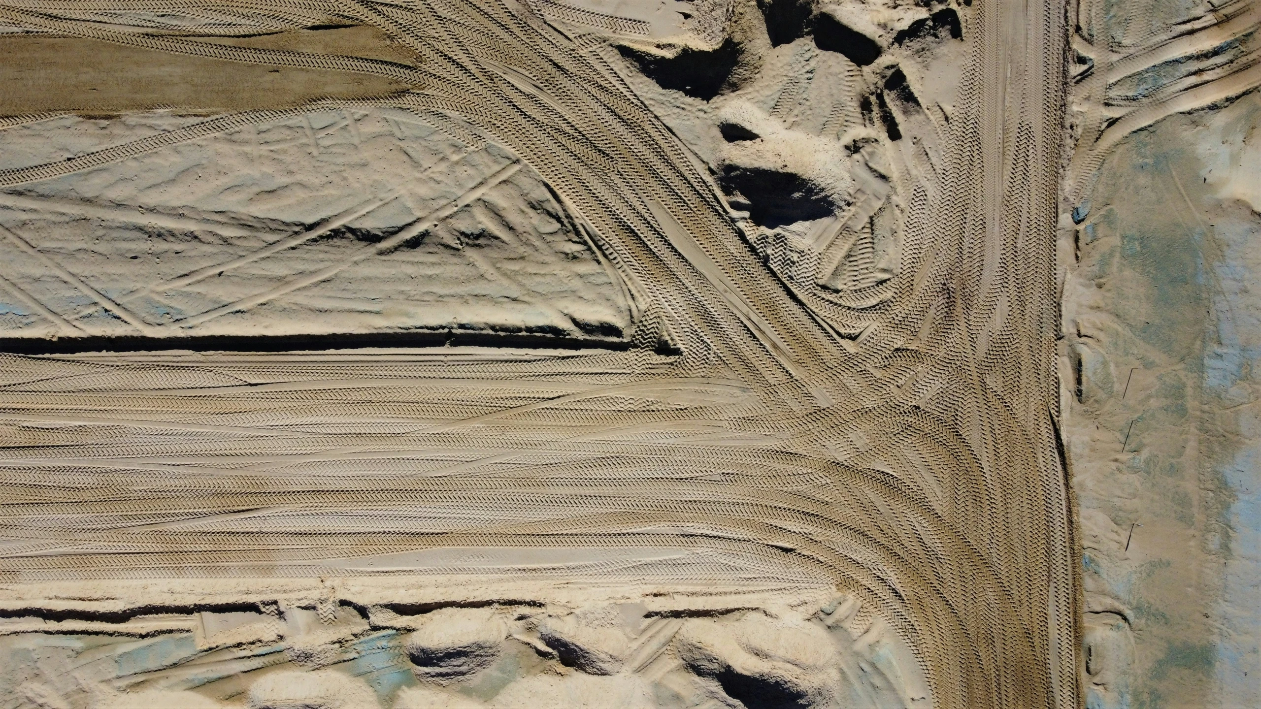 an aerial view of mud textures in a rural area