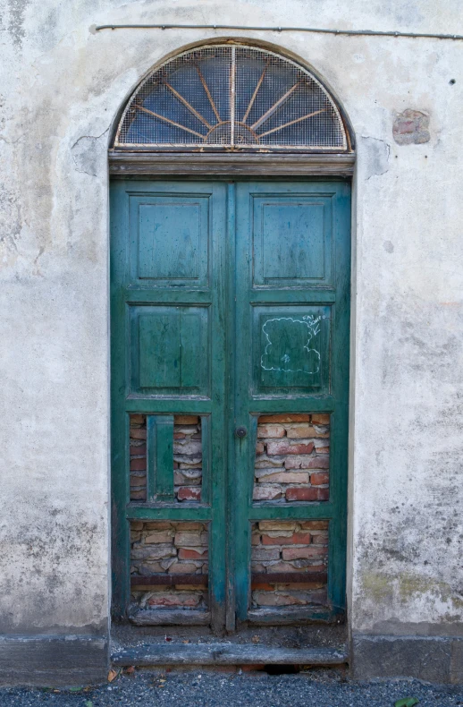 an open door with brickwork in front