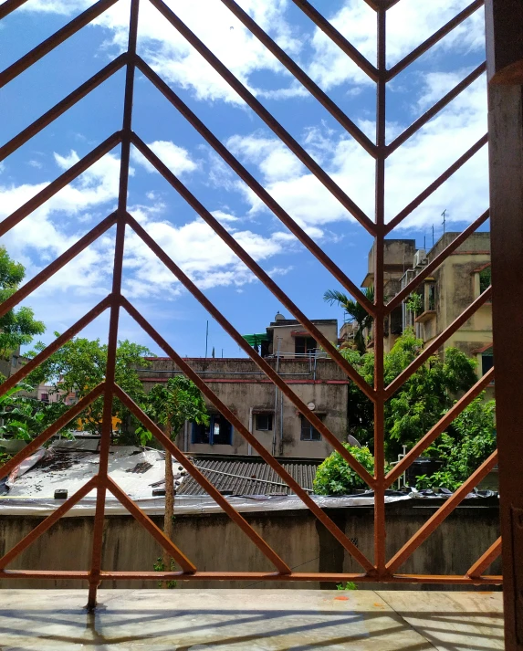 a tall wooden structure sitting next to a building