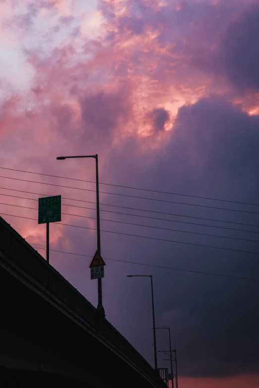 a view of some very beautiful colored clouds at sunset