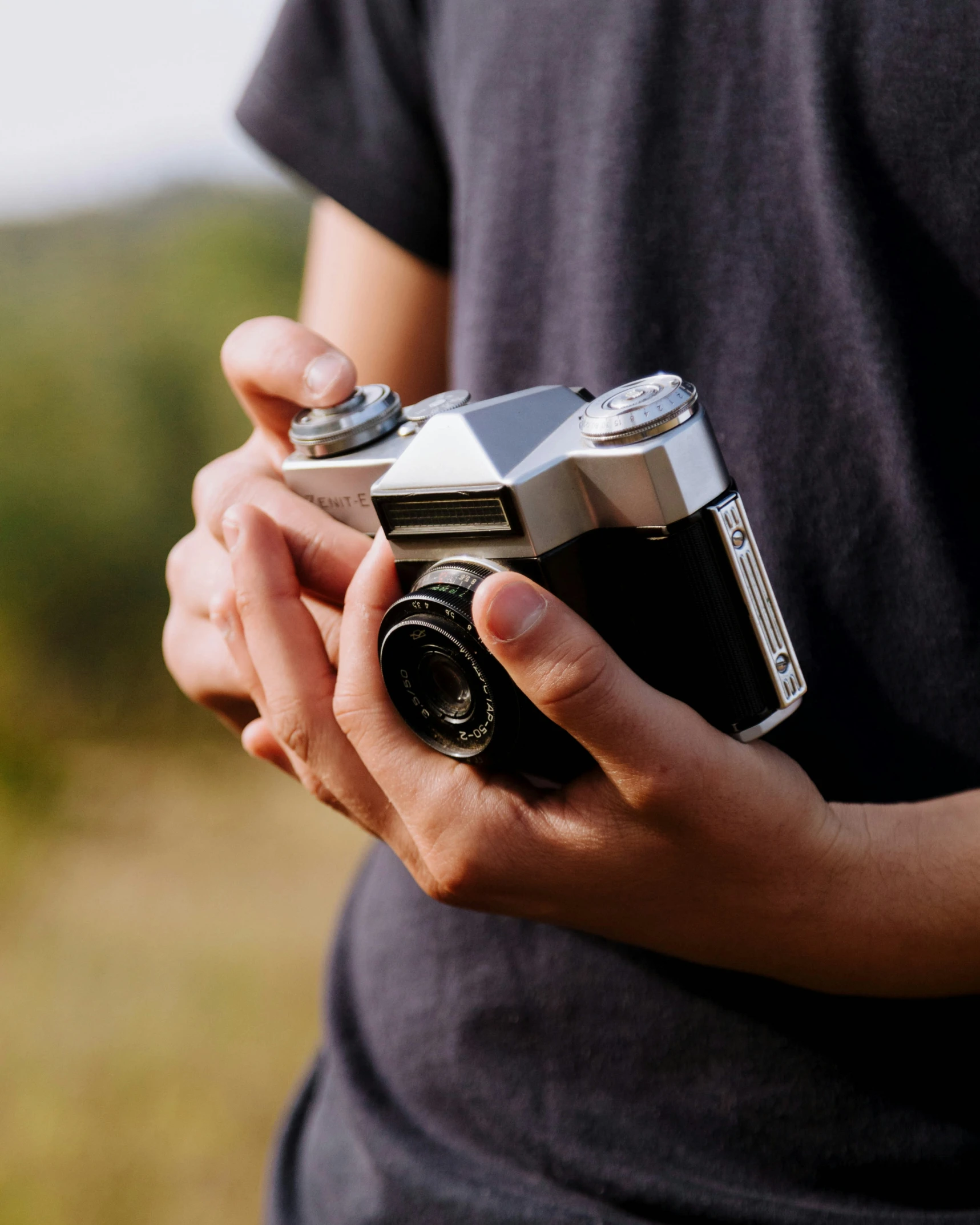 a person holding a camera in their hand