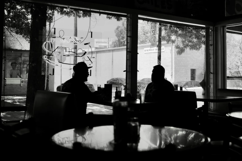 a couple of people sitting at a table together