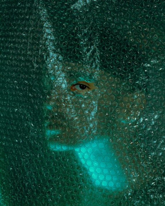 an up close image of a persons face on a window