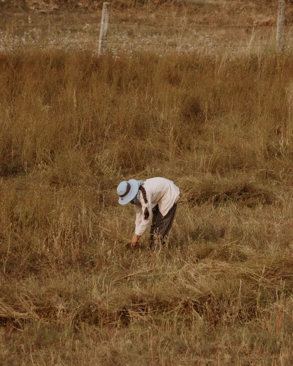 a man in a field playing with a frisbee