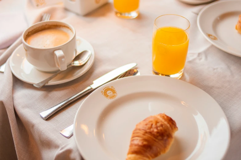 a view of breakfast food, coffee and orange juice