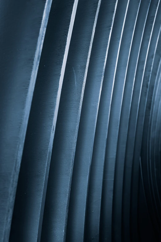 a series of gray striped panels with rain droplets