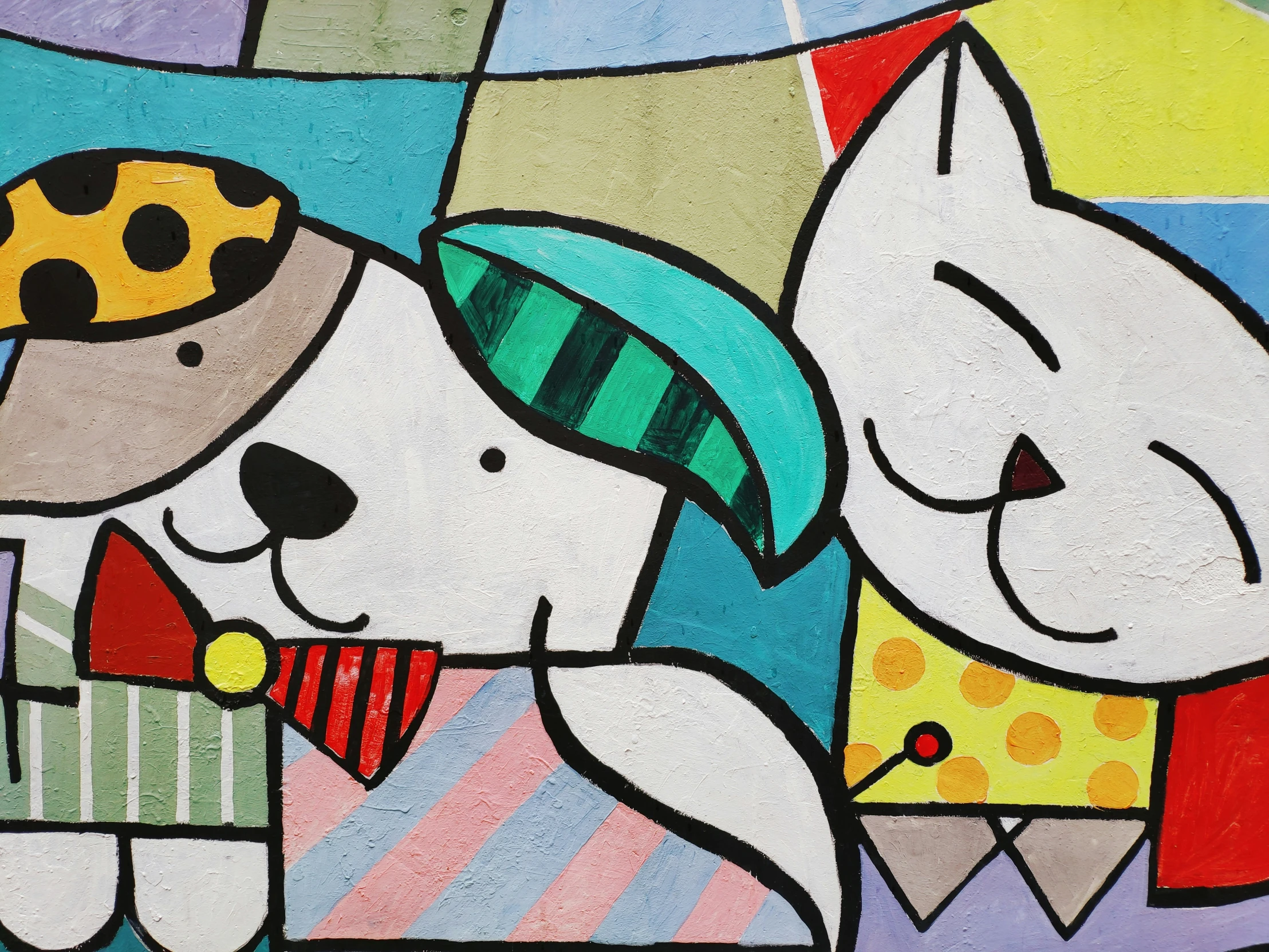 a colorful painting on a wall with a dog and cat holding each other