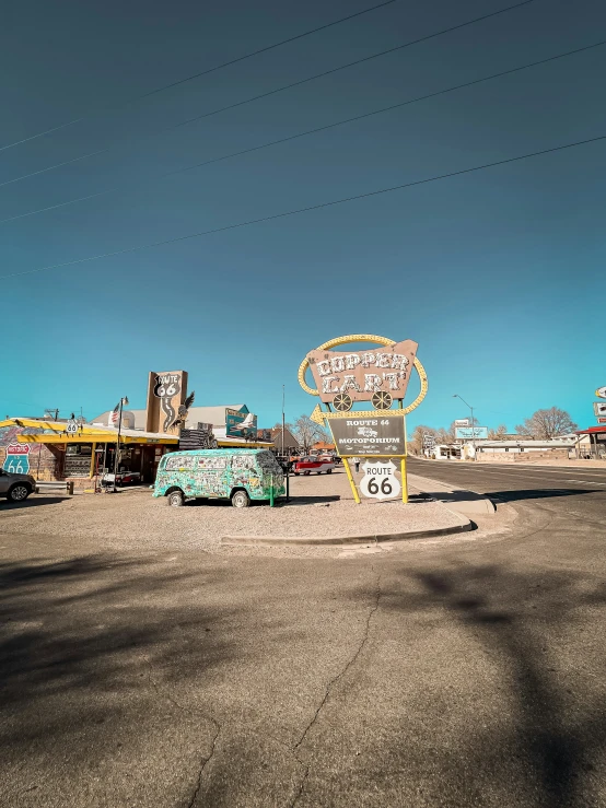 a colorful park on the sand with various items and signs