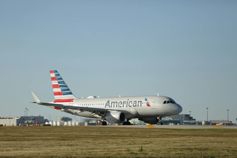 an american airlines plane taxiing down the runway