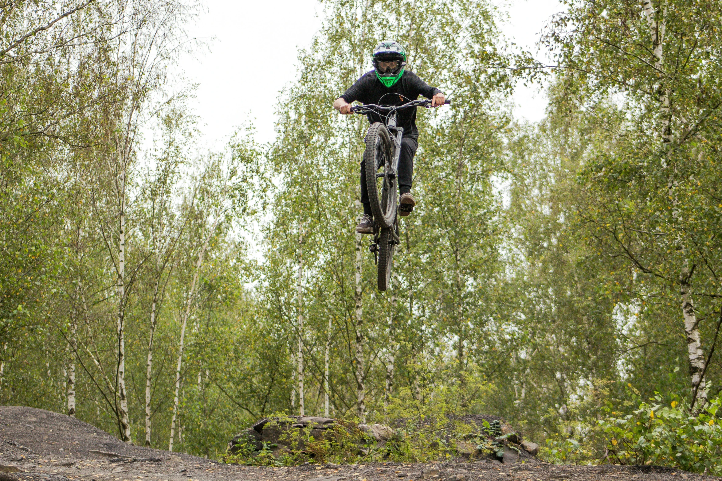 a man is in the air on a bike