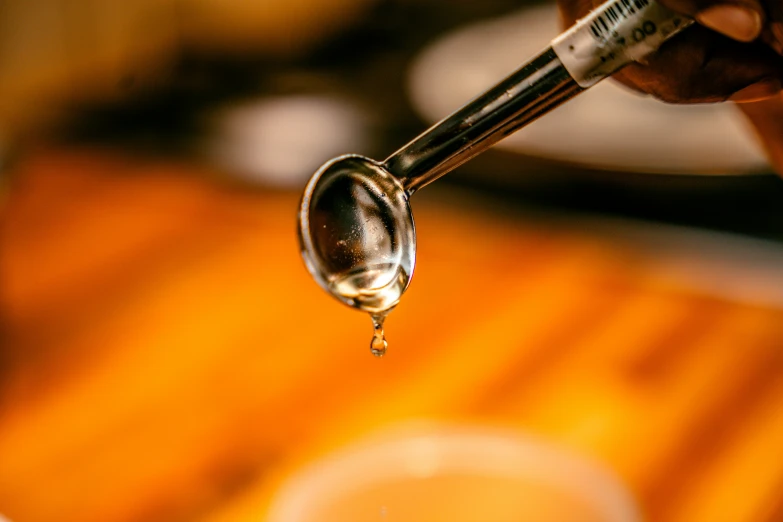 a spoon that is sitting on top of liquid