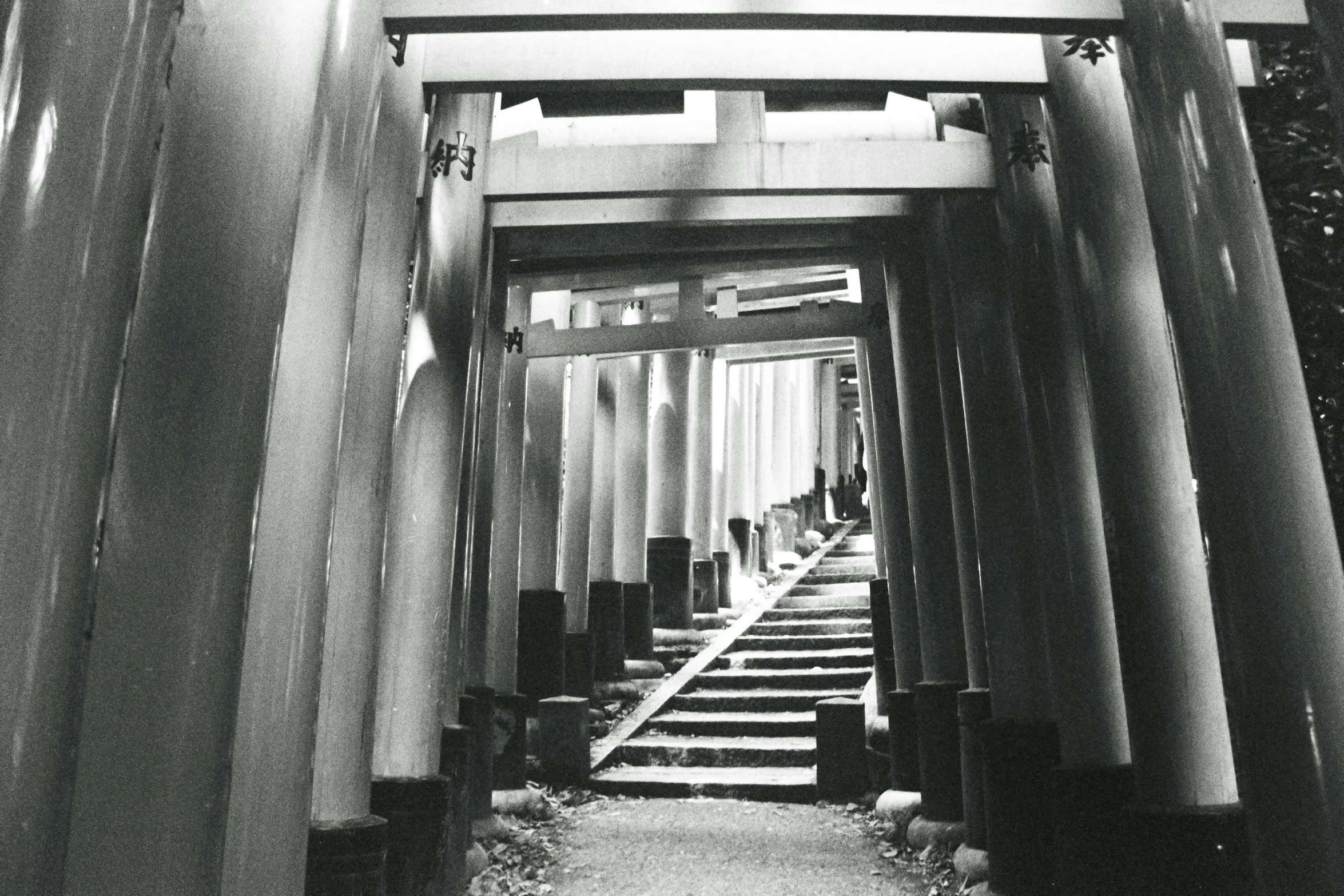 an entrance to a hall with steps and railings