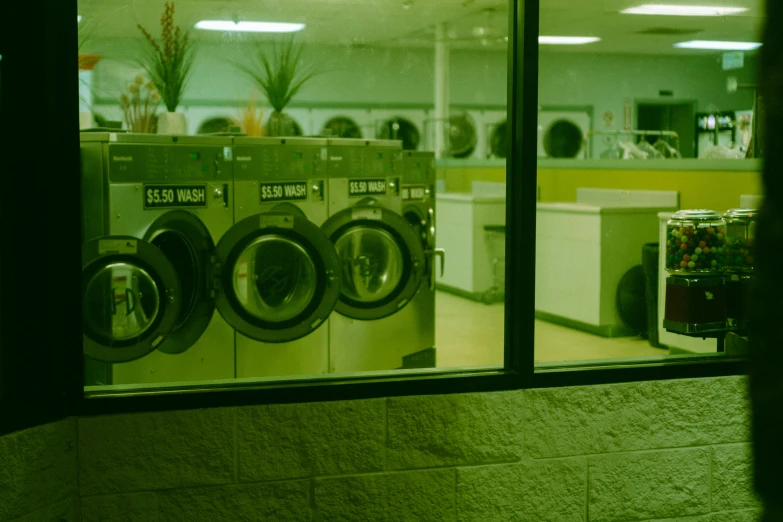 a row of washers sitting in a store window