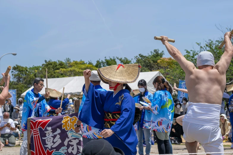 there are many people wearing blue clothing at this event