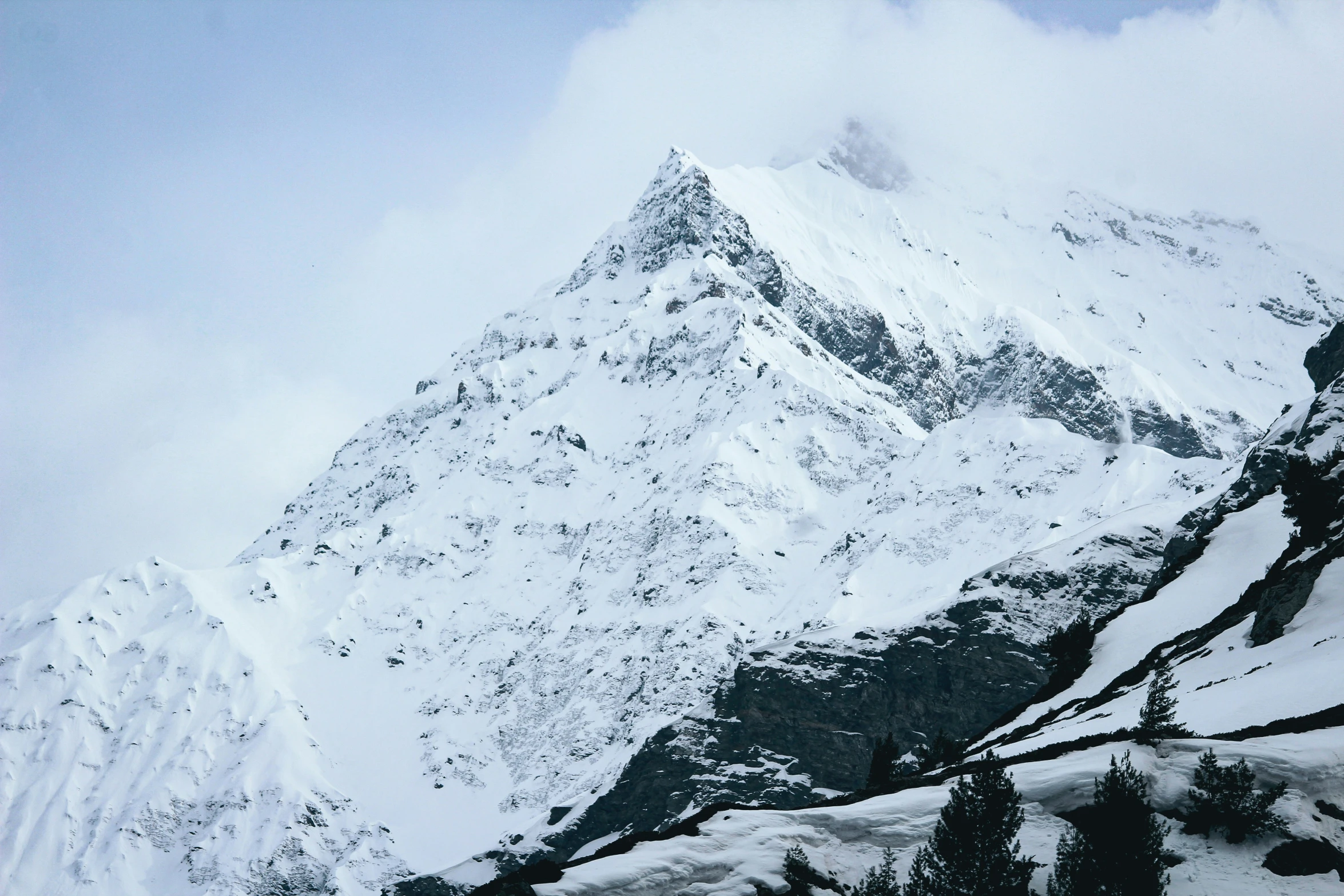 snow capped mountain in daylight with ski slope