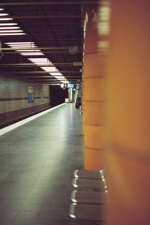 the lights are shining at the side of the subway