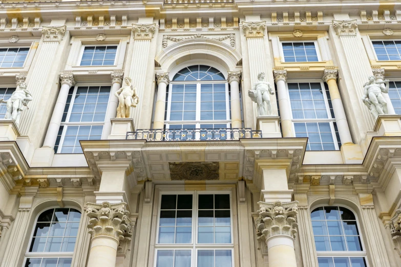 ornate building with decorative columns and statues on the front