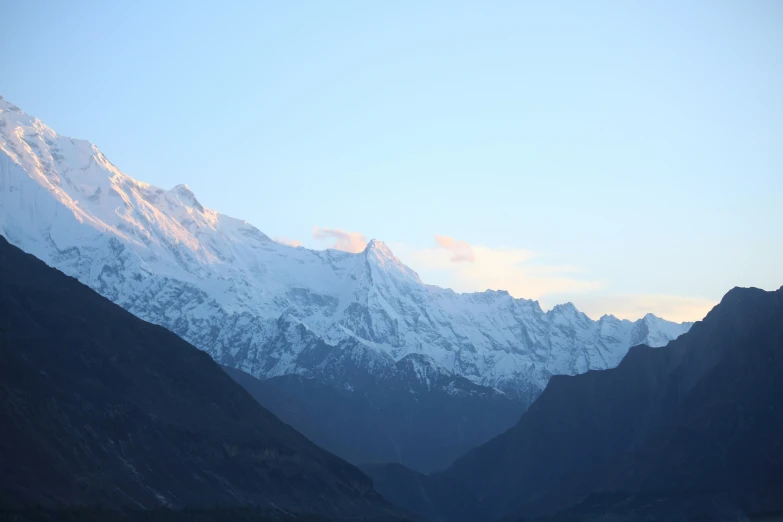 the mountains in the distance have snow capped tops