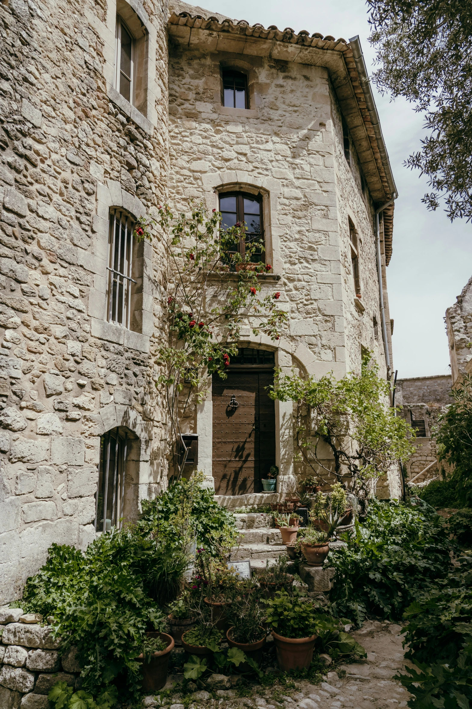 a stone building with a door is shown