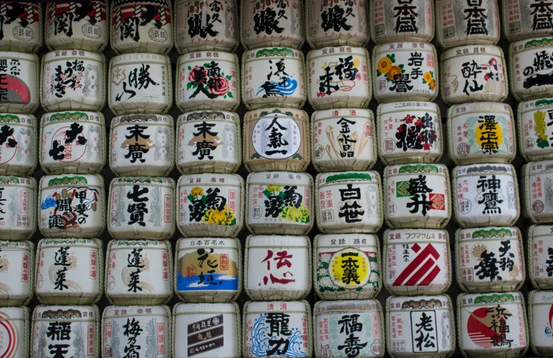 a number of small square containers covered in various asian writing