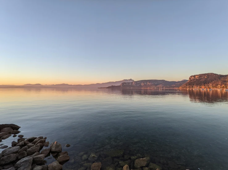 the water and shore is quiet for all to see