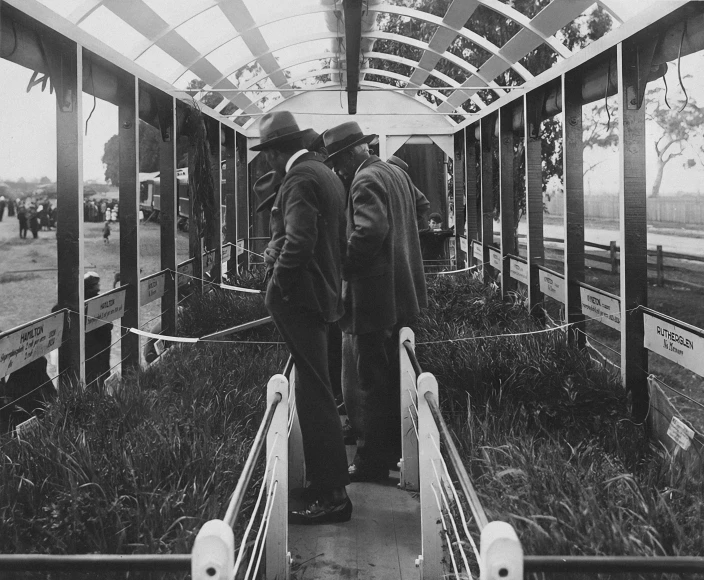two men walking down the stairs to the train