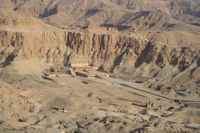 aerial view of a desert with some buildings